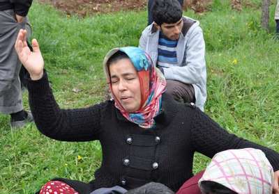 Boğazları kesilerek öldürülen anne ile oğulu toprağa verildi