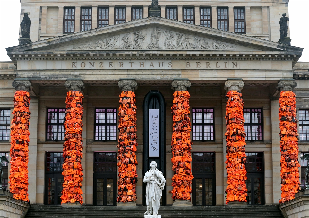 Artist Ai Weiwei covers Berlin venue with used life jackets