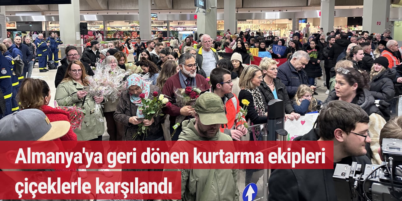 Almanya'ya geri dönen kurtarma ekipleri çiçeklerle karşılandı