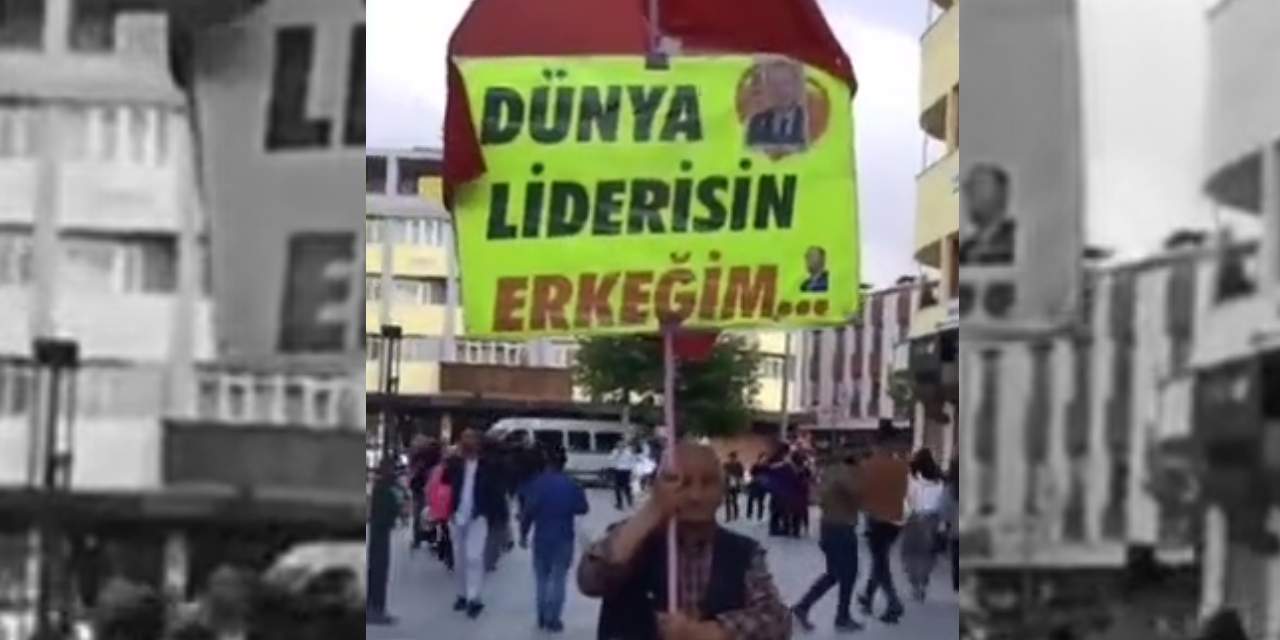 "Dünya liderisin erkeğim" yazılı pankartla şehri dolaştı
