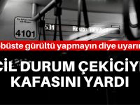 Otobüste uyarınca kafasını yardı